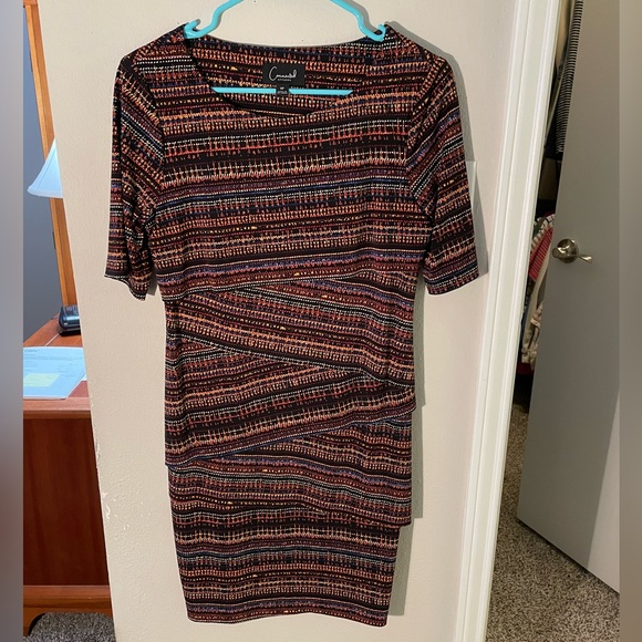 Connected multi color patterned dress. Beautiful fit and flattering on. - Picture 1 of 3